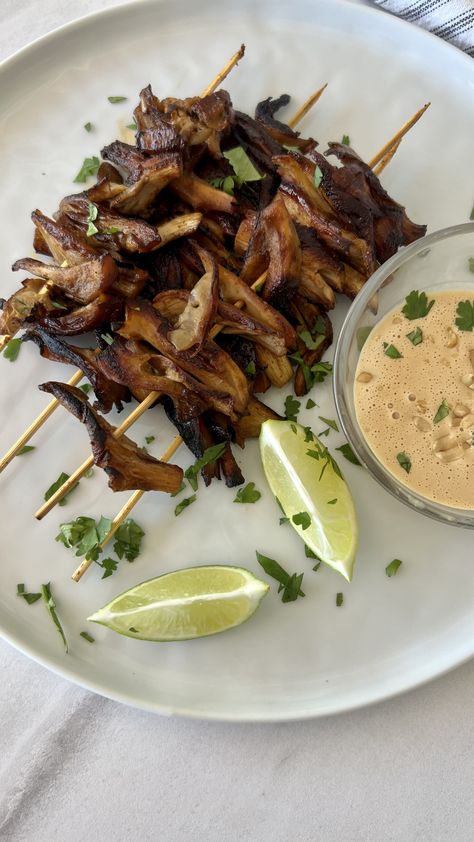 These mushroom skewers seared in a cast iron skillet are a must-try together with the spicy coconut-peanut sauce! The classic Southeast-Asian satay is grilled meat on a skewer, served with peanut sauce. This vegan version with oyster mushrooms is a wonderful meat-free alternative. My tip is to sear the marinated mushrooms in a cast-iron pan on a medium-low temperature for about 9 minutes on each side. Be patient here, it will be so worth it! Oyster Mushroom Skewers, Mushroom Satay, Mushroom Skewers, Marinated Mushrooms, Plant Kitchen, Oyster Mushrooms, Natural Peanut Butter, Peanut Sauce, Southeast Asian