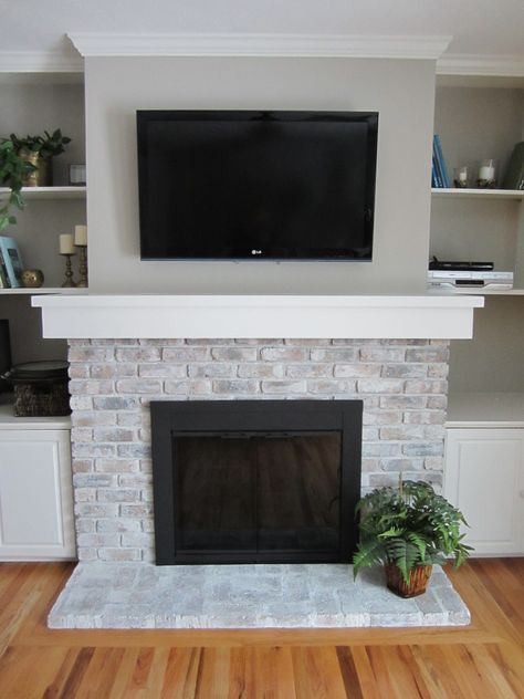 See how to white wash your fireplace for an inexpensive update! / HomeStagingBloomingtonIL Mantle Redo, Fireplace Mantle Designs, Chimney Ideas, Brick Fireplace Mantles, Paint Tricks, Fireplace Makeovers, White Wash Brick Fireplace, Fireplace Redo, Painted Brick Fireplace