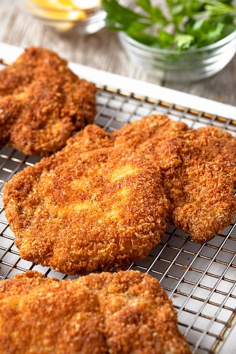 These fried pork chops are crispy on the outside and juicy on the inside, with a flavorful whisper of parmesan in the crust! | thecozyapron.com #friedporkchops #friedporkchopsrecipessimple #friedporkchopswithbreadcrumbs #friedporkchopsrecipesporkchops #porkchops Best Fried Pork Chops, Panko Pork Chops, Fried Boneless Pork Chops, Fried Pork Chops Recipe, Pork Chops Recipes, Fried Pork Chop Recipes, Pan Fried Pork Chops, Breaded Pork Chops, Pork Chop Dinner