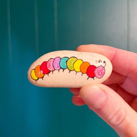 Hannah on Instagram: “A little colorful caterpillar 🐛 💕 #rockpainting #rockpaintings #rockpaintingartist #rockpaintinginspiration #caterpillar #spring” Rock Caterpillar, Painted Rock Caterpillar, Bug Painted Rocks, Insect Painted Rocks, Painted Rock Garden Bugs, Painted Rocks, Instagram