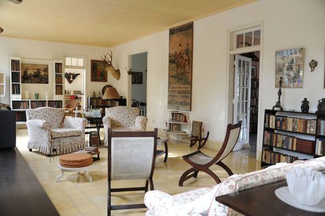 The Striking Places Ernest Hemingway Called "Home"  - HouseBeautiful.com Hemingway Decor, Ernest Hemingway House, Colonial Interior Design, Hemingway House, Colonial Interior, Ernest Hemingway, Celebrity Houses, Front Room, White Walls