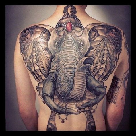 31. The unbelievable idea of an elephant on the back. This unusual presentation of the elephant will surprise the tattoo lovers. The enormous animal in the form of butterfly covers the whole back, which will suit strong and brave men. The work includes some details such as precious stones on its head and tusks.  - source Big Five Tattoo, Whole Back Tattoos Men, Back Tattoos Men, Five Tattoo, Indian Elephant Tattoo, Elephant Tattoo Meaning, Elephant Tattoo Design, Princess Tattoo, Tattoos Men