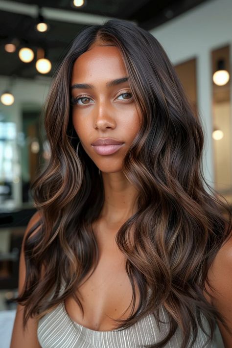 Woman with long, wavy hair and a neutral expression in a well-lit room. Brunette Framed Face Highlights, Dark Brown Hair Gloss, Warm Brown Highlights On Dark Hair, Face Framing Balayage Brunettes, Dark Chocolate Hair With Highlights, Chocolate Brunette Balayage, Balayage Front View, Warm Brown Hair Balayage, Subtle Balayage Brunette Dark