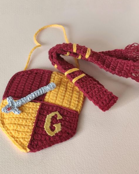 🦁🌟 Discover Gryffindor Pride Day: A Celebration of Courage and Bravery! 🌟🦁 Attention all witches and wizards! March 22 is Gryffindor Pride Day, a special occasion dedicated to celebrating the noble values of bravery, courage, and chivalry that define the Gryffindor house at Hogwarts School of Witchcraft and Wizardry. 🏰✨ For those who may not know, Gryffindor is one of the four houses at Hogwarts, fo Harry Potter Applique Pattern, Gryffindor Diy, Hp Crochet, Harry Potter Coins, Harry Potter Keychain, Gryffindor Pride, Harry Potter Crochet, Gryffindor House, Wizard School