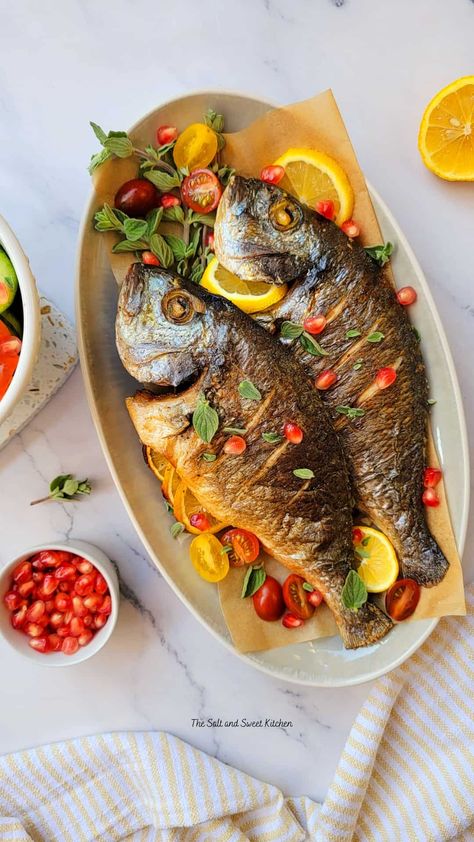 Baked whole fish Fish Recipes Whole, How To Cook Whole Fish In The Oven, Whole Fish Baked In Oven, Cooking Whole Fish In Oven, Cook Whole Fish, Tilapia Whole Fish Recipes, Baking Whole Fish In Oven, Whole Cooked Fish, Whole Perch Fish Recipes