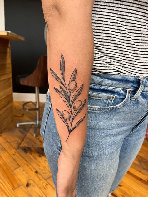 Girl with tattoo Olive Branch Shoulder Tattoos For Women, Green Olive Branch Tattoo, Lettered Olive Shell Tattoo, Neo Traditional Olive Branch, Olive Branch Tattoo Color, Leaf Tattoo Traditional, Olive Branch Leg Tattoo, Olive Branch Wrap Around Tattoo, Traditional Olive Branch Tattoo