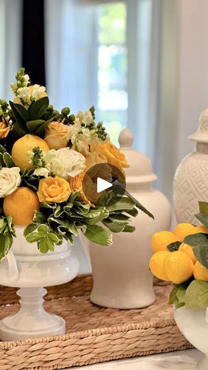 22 reactions | I’m loving lemons this time of the year.  There are so very many uses for them!  Of course one of my favorite things is styling a lemon themed tablescape. I wanted to make a sunshine yellow centerpiece and decided to include lemons in the actual arrangement! 

#lemontablescapes 
#lemon 
#lemoncenterpiece | Celebrate & Decorate | Acoustic Duo · Here Comes The Sun Oranges Lemons Centerpiece, Lemon In Vase With Flowers, Lemon Floral Centerpiece, Lemons In Vases With Flowers, Lemon And White Flower Centerpiece, Yellow Centerpiece, Yellow Centerpieces, Lemon Centerpieces, Italian Table