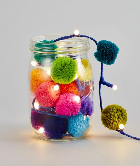 Pompom galore lights 0634158470325 m easy to make pompom lights for a bedroom or outdoor party lighting in the summer garden. Nx Crafts Using Pom Poms, Pom Pom Accessories, Pompon Diy, Crafts 2023, Diy Jar, Pom Crafts, Diy Pom Pom, Pom Pom Crafts, Rainbow Light