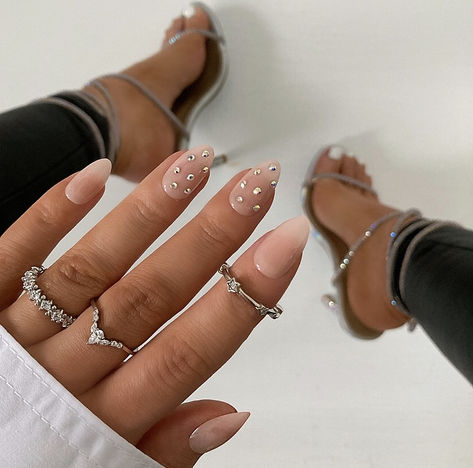 With a "Subtle Hint" of pizzazz, this classic nude set is a simple, yet memorable look. These short almond nails are created using a pale nude cover color and feature a bedazzled accent nail with sparkly diamond-like rhinestones.

Ditch the plastic! Kiara Sky’s xPress Pro Press-on Nails are 100% acrylic and 100% fabulous! Designed to be quick and convenient, our acrylic nails can be applied in 3 easy ways! Medium Natural Nail Designs, Pedicure Photoshoot, Mom Nail Ideas, Zeta Nails, Acrylic Manicure, Diamond Press, Kiara Sky, Short Almond Nails, Acrylic Toes