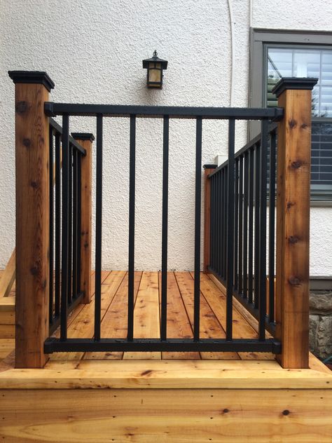 Westbury aluminum railing (black) attached to cedar posts Wrought Iron Porch Railings, Porch Handrails, Porch Railing Designs, Deck Stair Railing, Front Porch Railings, Outdoor Stair Railing, Porch Stairs, Front Porch Steps, Wrought Iron Stair Railing