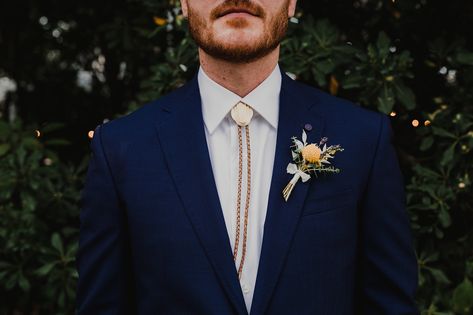 Texas in downtown austin. Allan house. Wedding inspiration. Bolo tie vibes Navy Suit Bolo Tie, Bolo Tie Groomsmen, Wedding Bolo Tie, Bolo Tie Wedding, Schoolhouse Wedding, Blue Tuxedo Wedding, Green Wedding Suit, Blue Suit Wedding, Groomsmen Ties