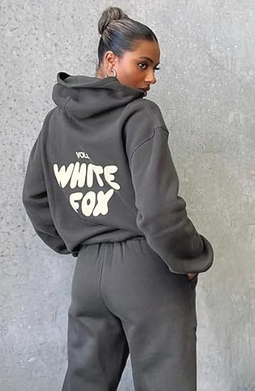 Vibrant Graphic Design: The pullover showcases a bold 'White Fox' graphic print across the back, adding a trendy and eye-catching touch to the ensemble. Stylish Loungewear Set: This two-piece set features a long-sleeved hooded pullover sweatshirt and matching jogger bottoms for a comfortable yet chic athleisure look. Relaxed Fit: Crafted from a soft, stretchy fabric blend, the sweatshirt and joggers offer a comfortable, relaxed fit for lounging or light exercise. White Fox Hoodie, Lounge Wear Sets, Fox Hoodie, Outfit Hoodie, Hoodie And Sweatpants, Hoodie Set, Sweatshirt Set, Tracksuit Set, Tracksuit Women