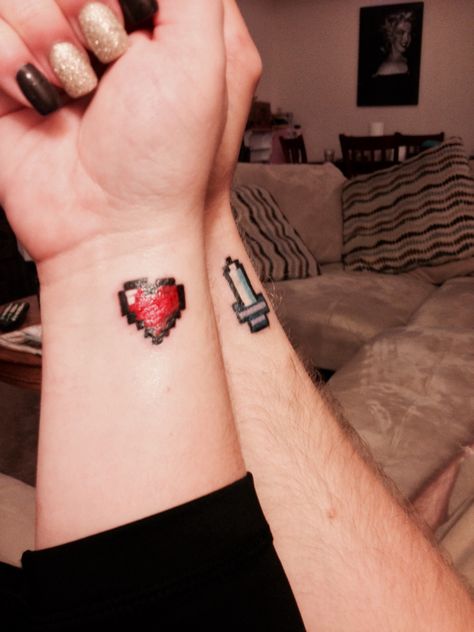 Couple tattoo: Zelda Heart and Sword Bit Tattoo, Couple Wrist Tattoos, Infinity Couple Tattoos, Couple Tattoos Love, Zelda Tattoo, Gamer Tattoos, Tattoo Couple, Small Couple Tattoos, Tattoos Infinity