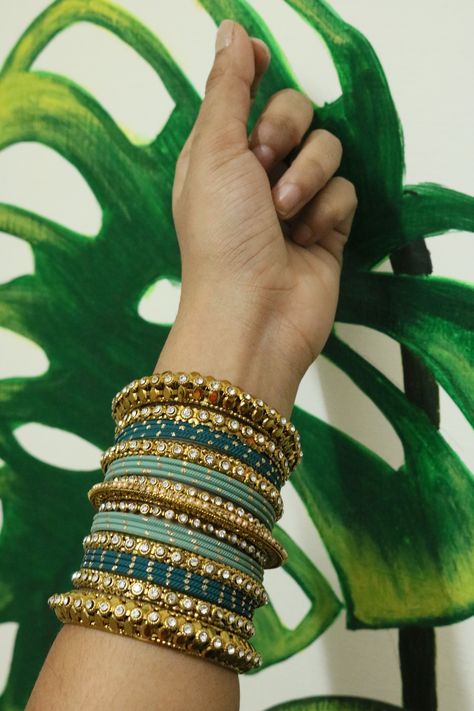 A detail combination of green and golden bagle set. Follow us on Instagram - @Studio_kalai Bridal Starting range - 500 rs only Bridal Bangle Set, Silk Thread Earrings Designs, Green Bangles, Silk Thread Bangles Design, Thread Bangles Design, Bangle Design, Wedding Aesthetics, Colorful Bangles, Indian Bangles