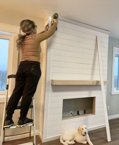 Diy Fireplace Wall Electric, Shiplap Diy Fireplace, Fireplace With Vertical Wood, Diy Fireplace Tv Wall With Bookshelves, Electric Fireplace Ideas With Shiplap, Diy Electric Fireplace Mantle Shiplap, Diy Fireplace Framing, Framing Electric Fireplace, Decor Around Large Picture