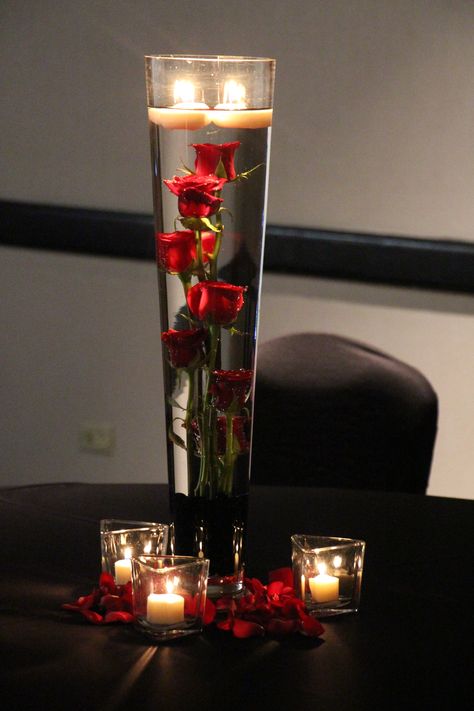 Submerged red roses Submerged Rose Centerpiece, Black Red And White Wedding Decorations, Red White Black And Gold Party Decor, Rose Centerpieces Quinceanera, Red Quince Theme Decorations, Red Quince Centerpieces, Red Rose Centerpiece Wedding, Red Rose Decor, Cheap Wedding Table Centerpieces