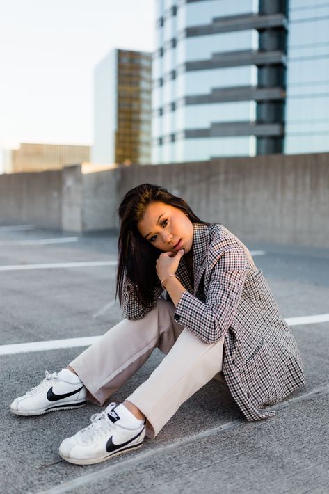 Woman sitting on parking garage rooftop posing for photoshoot Portrait Photoshoot Outfits, Parking Fashion Photography, Parking Garage Photoshoot Professional, City Parking Garage Photoshoot, Creative Photoshoot Locations, Parking Garage Photoshoot Outfit Ideas, Garage Top Photoshoot, Senior Parking Garage Photoshoot, Parking Garage Headshots