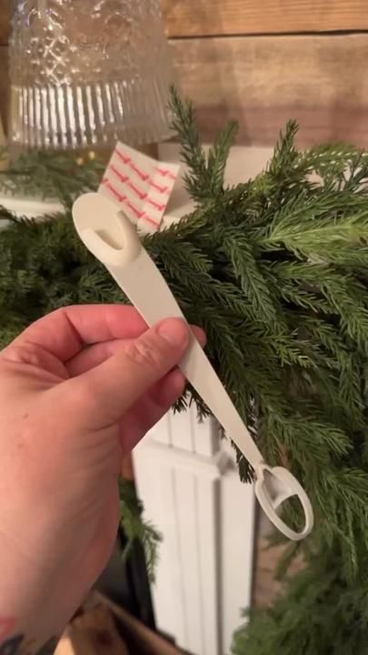 Hanging Garland Around Mirror, How To Hang Stockings On Stairs, Ways To Hang Garland, Attaching Garland To Mantle, How To Hang Christmas Garland On Mantle, How To Hang Garland Around Mirror, How To Hang Garland On Mirror, Command Hooks For Garland, Garland Hanging Hack