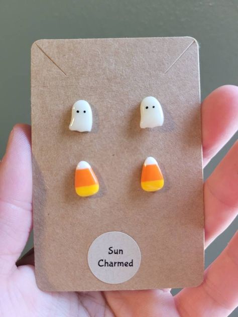 Super fun Halloween Candy Corn and Ghost Stud Earring Set. Each package comes with 1 set of Candy corn studs and 1 set of Ghost Earrings. Materials: The metal material is stainless steel and nickel free. Stainless steel is hypoallergenic and suitable for sensitive skin. The ghost and candy corn are made of polymer clay and glazed for a finished look. Size: The ghost and candy corn are approximately 1cm in length and .75cm in width. Care Instructions: Remove when sleeping and entering water.  Not Candy Corn Polymer Clay Earrings, Candy Corn Clay Earrings, Candy Corn Earrings Diy, Seasonal Polymer Clay Earrings, Candy Corn Outfit, Polymer Clay Stud Earrings Ideas, Clay Stud Earrings Diy, Polymer Clay Earrings Halloween, Polymer Clay Halloween Earrings