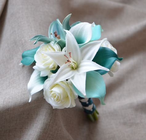 Thank you so much! Keep the confidence and we will tide over the difficulties together! ------------------------------------------------------------------------------ ------------------------------------- **This list is a wedding package including: - The cascade bridal bouquet, with real touch teal Picasso and teal calla lilies, ADD some turquoise calla lilies, ivory white roses, and teal lilies, white lilies. -USD118 - One toss bouquet, same flowers with the bridal bouquet, 6inch, USD32. - The Lilly Bouquet Wedding, Teal Wedding Bouquet, Aqua Wedding Colors, Teal Wedding Theme, Teal Bouquet, Turquoise Bouquet, Cascade Bridal Bouquet, Wedding Bridesmaid Flowers, Lily Bridal Bouquet