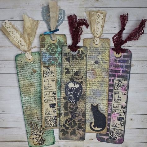 Handmade mixed media / junk journal style bookmarks made from old book pages.  Each bookmark is unique and no two are exactly alike. Made with both modern and vintage materials. The bookmarks are approximately 7.25x2 inches in size, not including the ribbon/tassel. The bookmarks are two sided, with coordinating scrapbook paper on the backside of each.  See photos for both sides of each bookmark.  Please note several of the bookmarks have textured and layered elements and are not completely smooth.  Please contact us if you have any questions or concerns. Thank you for visiting our shop! Danielle and Selena Book Mark Craft Ideas, Mixed Media Bookmarks, Junk Journal Bookmark, Bookmark Packaging Ideas, Collage Bookmarks, Goth Bookmark, Collage Art Vintage, Folio Ideas, Repurposed Books