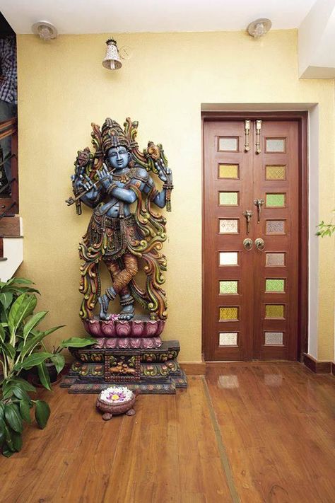 Hindu home decor with Krishna statue Entrance Door Decor, Vani Vats, House Main Door, Indian Room Decor, House Main Door Design, Temple Design For Home, Home Door Design, Indian Home Design, Ethnic Home Decor