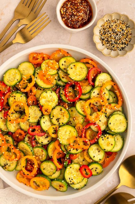 This simple to make, viral Cucumber and Bell Pepper Salad is packed with nutrients, and is delightfully balanced. With crunchy peppers and cucumber, ginger sesame dressing, honey, chili crunch oil and everything bagel seasoning, this salad is sweet, savory, and so satisfying. Cucumber Sweet Pepper Salad, Chili Crunch Oil, Ginger Sesame Dressing, Viral Cucumber, Chili Crunch, Bell Pepper Salad, White Balsamic Vinaigrette, Sesame Ginger Dressing, Pepper Salad