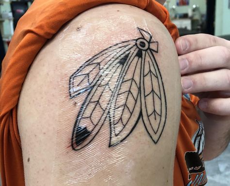 Chicago Blackhawks feathers by Sam at Nomad Tattoo Western IL. #tattoos #tattoo #beauty Chicago Blackhawks Tattoo, Blackhawks Tattoo, Nomad Tattoo, Tattoo Western, Feathers Tattoo, Trending Tattoos, Prison Tattoos, R Tattoo, Feather Tattoo