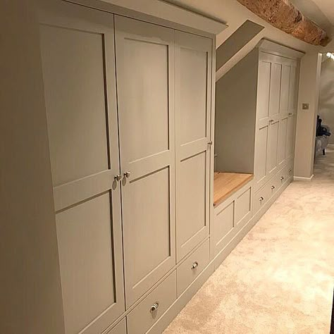 Built In Wardrobe With Bench, Loft Built In Storage, Eaves Door Ideas, Under Eves Wardrobe Storage, Storage On Top Of Wardrobes, Basement Wardrobe Storage, Loft Room Storage, Built In Wardrobe Ideas Sloped Ceiling, Loft Cabinets