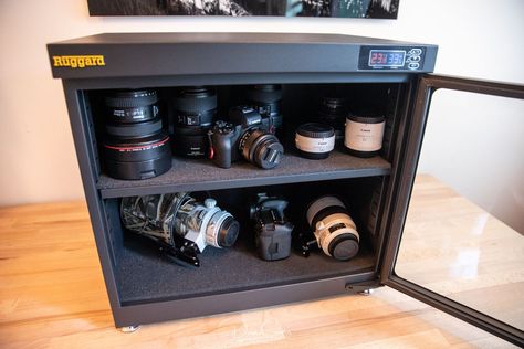 Why I Store My Camera Gear in a Dry Cabinet Photography Equipment Beginner, Gear Storage Ideas, Photography Gear Storage, Photography Equipment Storage, Camera Gear Photography Equipment, Camera Shelf, Camera Gear Storage, Camera Gear Organization, Display Photography