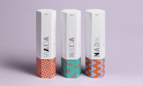 Created by two students, Thomas Squire and Eve Warren, Nada features geometric patterns in bold colors.  "Nada isn’t just a brand for healthy food, but a brand that communicates through fashion, beauty, well being and body confidence." Packing Inspiration, Hexagon Box, Cosmetics Packaging, Socks Packaging, Cosmetic Packaging Design, Box Packaging Design, Student Project, Packing Design, Food Packaging Design