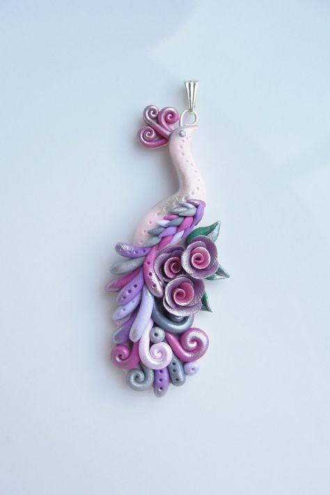 *POLYMER CLAY ~ Peacock pendant handmade from polymer clay in pink, purple and silver colours. Polymer Clay Peacock, Clay Peacock, Polymer Clay Embroidery, Polymer Clay Flower Jewelry, Peacock Pendant, Polymer Clay Figures, Polymer Clay Animals, Purple And Silver, Polymer Clay Jewelry Diy