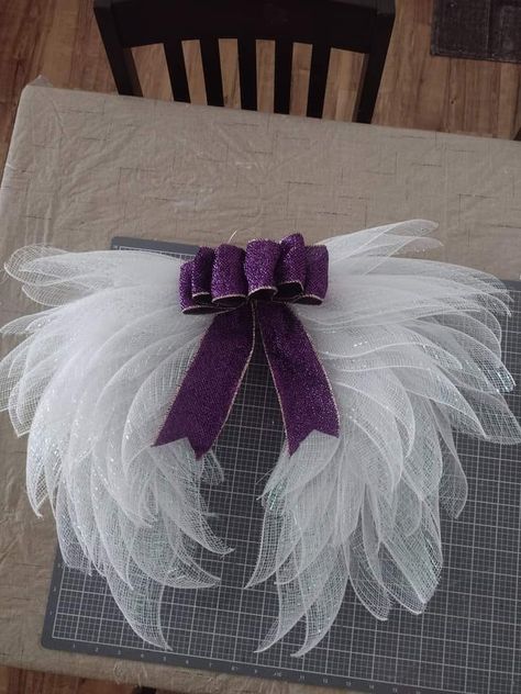 Dollar Tree Fanatics Crafts & Decor | Made from the Dollar Tree heart wreath frame.💜 Heart Shape Wreath Ideas, Mesh Heart Wreath Diy, Angel Wings Wreath How To Make, Angel Wreath Diy, Dollar Tree Angel Wings, Dollar Tree 3d Wreath Form Ideas, Angel Wing Wreath Diy, Dollar Tree Heart Wreath, Mesh Angels