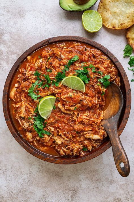 Chicken Tinga – shredded chicken in a smoky Chipotle tomato sauce. This Mexican recipe creates the most flavor-packed chicken that's perfect in tacos, quesadillas, enciladas, tostadas or over rice. A true crowdpleaser that the whole family will love! Healthy Chicken Tinga Recipe, Shredded Chicken Sauce, Pulled Taco Chicken, Best Chicken Tacos Recipe, Shredded Chicken Quesadillas, Mexican Chicken Nachos, Recipes Using Shredded Chicken, Shredded Chipotle Chicken, Mexican Pulled Chicken