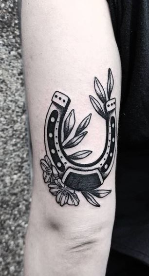 Horseshoe Tattoo Back Of Arm, Traditional Horseshoe Tattoo Black, American Traditional Horseshoe Tattoo Black, Old School Horseshoe Tattoo, Horshoe Tatoos Traditional, Trad Horse Shoe Tattoo, Horseshoe Elbow Tattoo, South Western Tattoo, Horse Shoes Tattoo