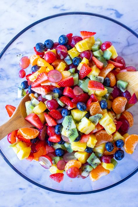 This beautiful Rainbow Fruit Salad is made with so much delicious and colorful fruit! It's easy to make and so versatile. It's perfect for a healthy snack that kids will love! Enjoy it for breakfast, snacks or even dessert! #fruitsalad #breakfast #rainbowfoods #healthysnack Kids Fruit Salad, Fruit Only Breakfast Ideas, Mini Fruit Salad, Rainbow Fruit Bowl, Rainbow Breakfast Ideas, Fruit Bowl Display For Party, Rainbow Fruit Board, Colorful Fruit Salad, Colorful Party Food