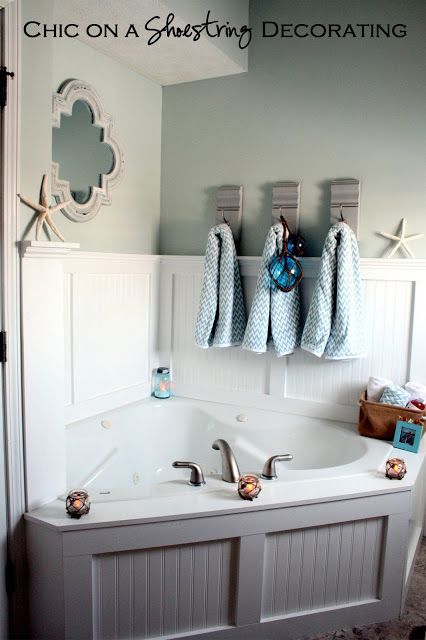 love this corner tub with board and batten-beach coastal bathroom by Chic on a Shoestring Decorating Coastal Bathroom Decor, Beadboard Bathroom, Beachy Bathroom, Bathtub Surround, Corner Tub, Decorating Bathroom, Beach Bathroom Decor, Nautical Bathrooms, Coastal Bathrooms