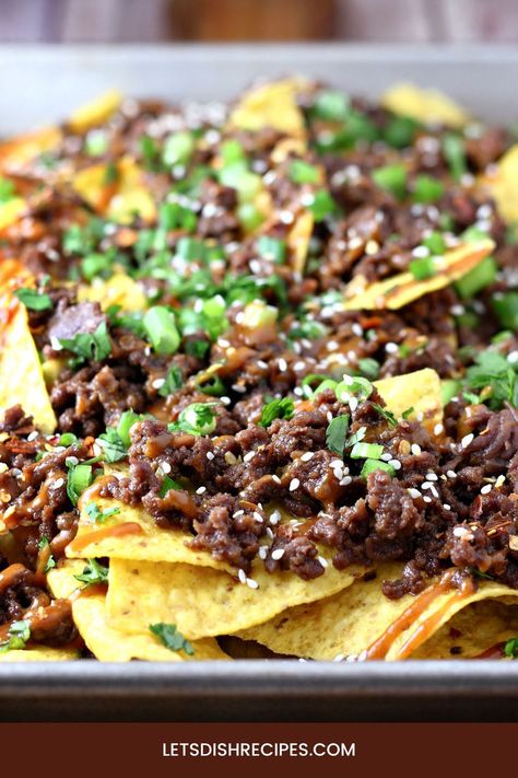 Ground beef is seasoned with garlic, ginger and soy sauce, with a hint of brown sugar for sweetness, then topped with peanut sauce in these unique and delicious nachos. Ground Beef Spaghetti Sauce, Slow Cooker Spaghetti Sauce, Nachos Recipe Beef, Beef Nachos, Homemade Peanut Sauce, Grilled Beef Recipes, Homemade Meatloaf, Thai Beef, Nachos Beef