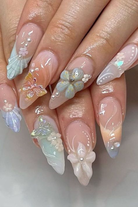 Achieve a harmonious blend of soft pastel tones and vibrant colors with this nail design by @shi_nailedit featuring 3D flowers and butterflies, creating a whimsical and enchanting look that’s perfect for adding a pop of color to your style while maintaining a delicate and feminine aesthetic. Don't miss out on the latest trends in nail art! Head over to nailustrous.com now to dive into our comprehensive article and discover a world of stunning ideas waiting just for you! Cute Nails 3d Flowers, 3d Nails Aesthetic, Nail Inspo 3d Art, Nail Art With Flowers Design, Pastel Colorful Nails, Colorful 3d Nails, Nail Designs 3d Art, Nail 3d Art, Butterfly 3d Nails