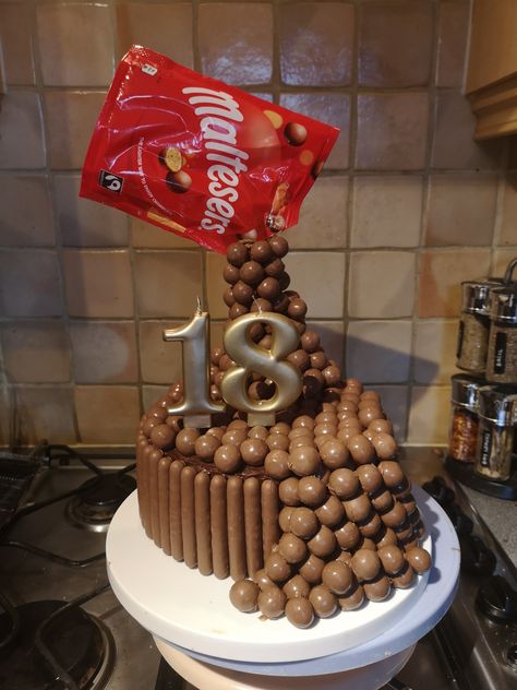 18th birthday Malteser anti gravity cake Malteaser Birthday Cake, Malteser Birthday Cake, Maltesers Cake, Cake 18th Birthday, Gravity Cakes, Rainbow Sprinkle Cakes, Camping Cake, Malteser Cake, Anti Gravity Cake