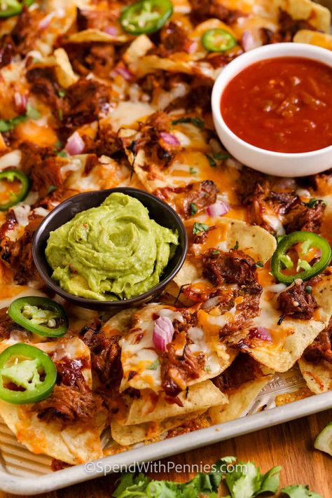 Serve these pulled pork nachos for a game day appetizer or even an afternoon snack. These hearty nachos are made with BBQ pulled pork, cheese, tortilla chips, and more extra toppings. Loaded nachos like these are sure to get rave reviews! #pulledporknachos #pulledporknachosrecipe #nachos #spendwithpennies Pulled Pork Nachos Recipe, Pulled Pork Sauce, Nachos Loaded, Easy Pulled Pork, Homemade Bbq Sauce Recipe, Pulled Pork Nachos, Slow Cooker Bbq Chicken, Pork Nachos, Pulled Pork Leftovers