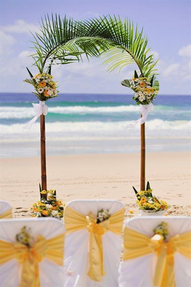 Celebrating at the beach can be as easy as a few palm fronds, flowers, sunshine and sashes. Delightful! Palm Tree Wedding Arch, Beach Wedding Arch, Wedding Alters, Wedding Wednesday, Ishigaki, Wedding Arches, Beach Ceremony, Beach Wedding Decorations, Hawaiian Wedding