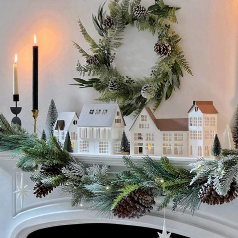 For a unique twist, use a navy blue tablecloth with white accents. Add starfish, seashells, and driftwood for a coastal theme. Nordic Xmas Decorations, Dutch Christmas Decorations, Xmas Fireplace Decor, Nordic Christmas Scandinavian Style, White Company Christmas, Christmas Decor Fireplace, Paper Christmas Village, Fireplace Christmas Decor, Nordic Xmas