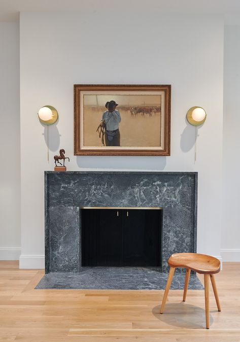 The fireplace surround and hearth create a contemporary look made all out of soapstone. Soap Stone Fireplace Hearth, Soapstone Fireplace Surround, Eclectic Fireplace, Soapstone Fireplace, Tile Fireplace Surround, Slate Fireplace Surround, Wood Mantle Fireplace, Slate Fireplace, Wood Mantle