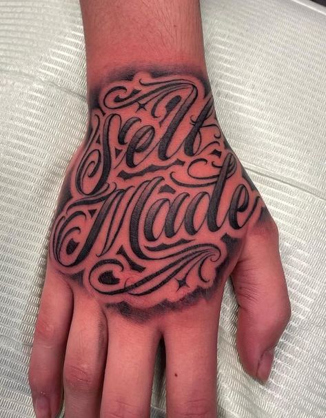 150 Hand Tattoos: Ideas and Meanings | Art and Design Back Hand Tattoos For Guys, Hand Tattoos Men Black, Self Made Hand Tattoo, Black Hand Tattoos Men, Male Hand Tattoos Ideas, Words Hand Tattoo, Hand Tattoo Stencils For Men, Hand Tattoos Writing, Hand Tattoo Words