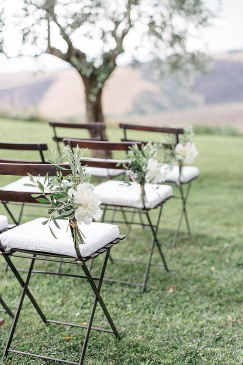 Simple and elegant ceremony aisle markers made of white peonies and olive branches. #wedding  #flowers #organicweddingideas #creativeweddingideas  #weddingdecor #minimalistweddinginspiration Sage Green Wedding Theme, Wedding Ceremony Chairs, Kirkenes, Greenery Wedding Decor, Rustic Wedding Decorations, Ceremony Chairs, Green Themed Wedding, Wedding Chair Decorations, Flowers And Greenery