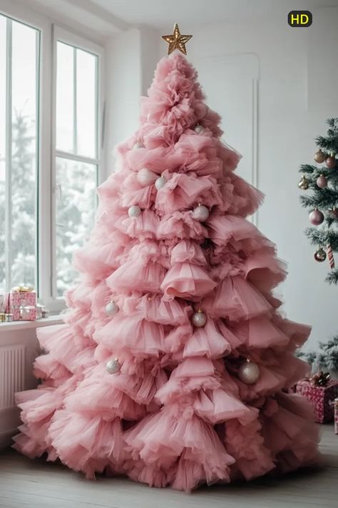 ↑↑ HD version on website. A magnificent pink tulle Christmas tree stands elegantly in a bright room near a window.  The tree is adorned with delicate, shimmering silver ornaments and topped with a gold star.  Soft light illuminates the fluffy layers of tulle, creating a dreamy, feminine aesthetic.  Gift boxes rest on the windowsill, completing the festive scene.  A partially visible traditional Christmas tree stands in the background providing contrast.wallpaper.webp Pink Tinsel Christmas Tree, Contrast Wallpaper, Tulle Christmas Tree, Tulle Christmas Trees, Holiday Event Decor, Fluffy Layers, Christmas Tree Stands, Tinsel Christmas, Tinsel Christmas Tree