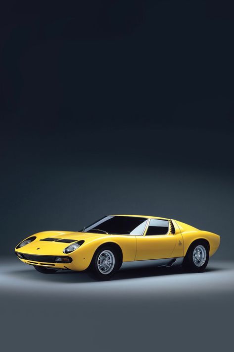 The Lamborghini Miura, introduced in the mid-1960s, stands as a legendary symbol of automotive innovation and luxury. Renowned for its groundbreaking design and powerful performance, the Miura continues to captivate car enthusiasts around the world.

Innovative Design: The Lamborghini Miura's design was revolutionary for its time. Designed by Marcello Gandini of Bertone, the car featured a sleek, low-slung body with distinctive "eyelashes" around the headlights and a mid-engine layout. Its aerod Cars Lamborghini, Classic Icon, Lamborghini Miura, Volkswagen Group, Lamborghini Cars, Car Wallpaper, Super Car, Car Features, Car Enthusiast