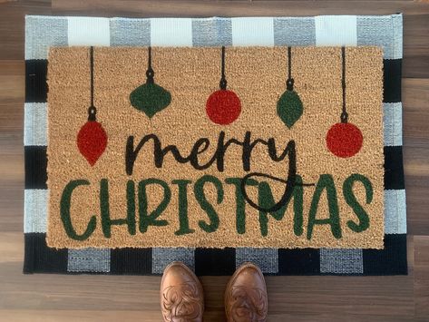 "Welcome your holiday guests with this festive \"Merry Christmas\" outdoor doormat.  Doormats are hand painted with outdoor-rated paint. These coir doormats measure approximately 18\"x30\" in size and have non-slip backing. This mat is suitable for outdoor use but keeping it out of rain and direct sunlight will prolong the life of the design. Listing includes one coir doormat only. Listing photos include display options for your front entry using this doormat." Christmas Rugs Outdoor Diy, Door Mat Ideas Christmas, Christmas Outdoor Mats, Christmas Painted Doormat, Christmas Door Mat Ideas Diy, Holiday Door Mat, Christmas Diy Doormat, Diy Christmas Mat, Doormat Painting Ideas