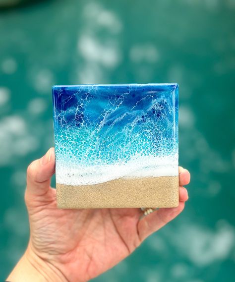 Add a touch of the ocean to your home with these stunning ceramic coasters! Measuring 4 inches, each coaster is crafted with multiple layers of resin to create a beautiful beach waves ocean scene. Perfect for protecting your surfaces from spills and stains while adding a stylish touch to your decor.  Please note due to the nature of working with resin each coaster will have its own unique beach wave scene.   Available in sets of 2, 4, or 6.   Please contact me with any questions! Diy Resin Painting, Ocean Coasters, Resin Boards, Ocean Themed Rooms, Resin Waves, Beach Resin, Beach Coasters, Beach Wedding Gifts, Waves Ocean